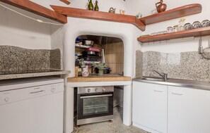 Enjoy cooking in this well-equipped kitchen with an oven, sink, and Bosch dishwasher.