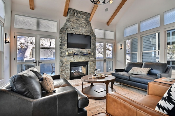 living room with hot tub patio out glass doors