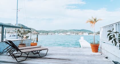 Breathtaking Views Of Mountains And Passing Boats Daily
