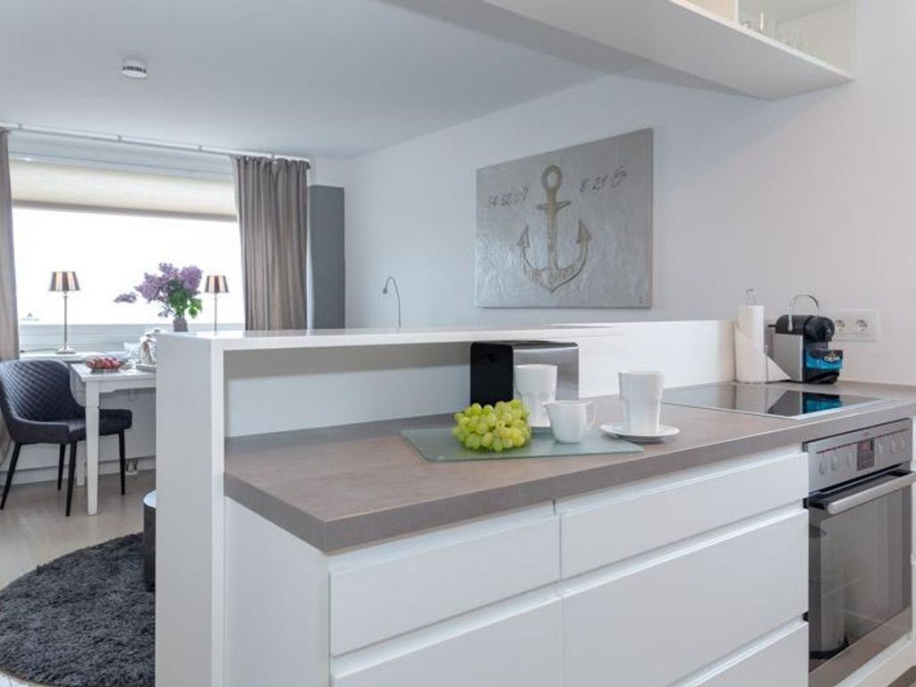 Fridge, stovetop, dishwasher, coffee/tea maker