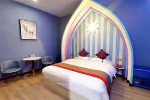 A bedroom with a bed, two chairs, a small table, and a unique striped headboard. - Roman Hotel (Jian'ou)
