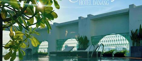 Outdoor pool, pool umbrellas, sun loungers