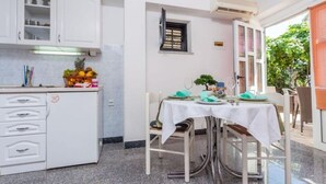 Apartment, 1 Bedroom, Balcony | Dining room - Comfortable Apartment With Balcony and Sea View (Okrug)