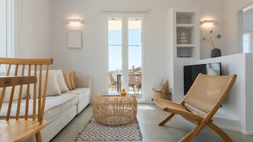 Appartement Familial | Coin séjour | TV connectée de 40 pouces avec chaînes numériques, Netflix