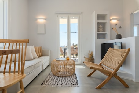 Family Apartment | Living area | 40-inch Smart TV with digital channels, Netflix, streaming services. AELIA Tinos