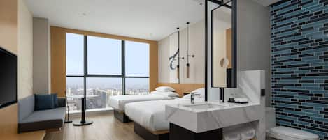 A modern hotel room with a large window, two beds, a bathroom with a marble sink, and a city view.