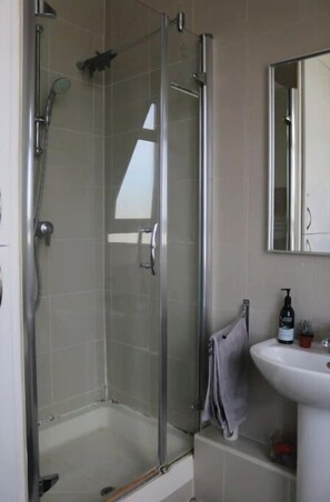 Bathtub, towels, soap, toilet paper