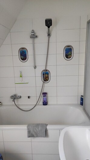 Combined shower/tub, hair dryer, towels, soap