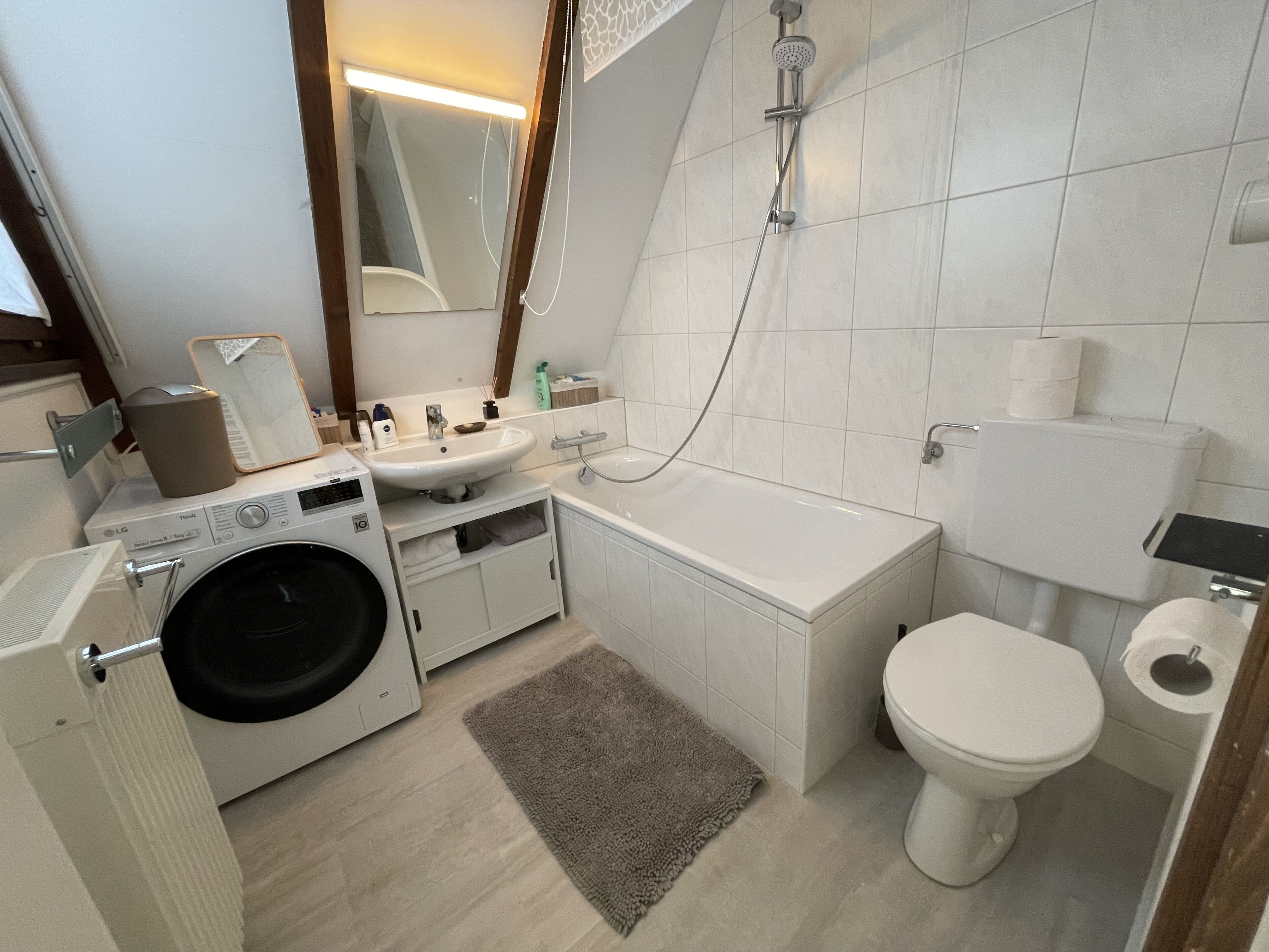 Bathtub, hair dryer, towels, soap