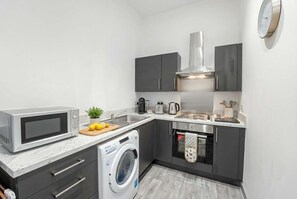 Coffee/tea maker, fridge, microwave, oven