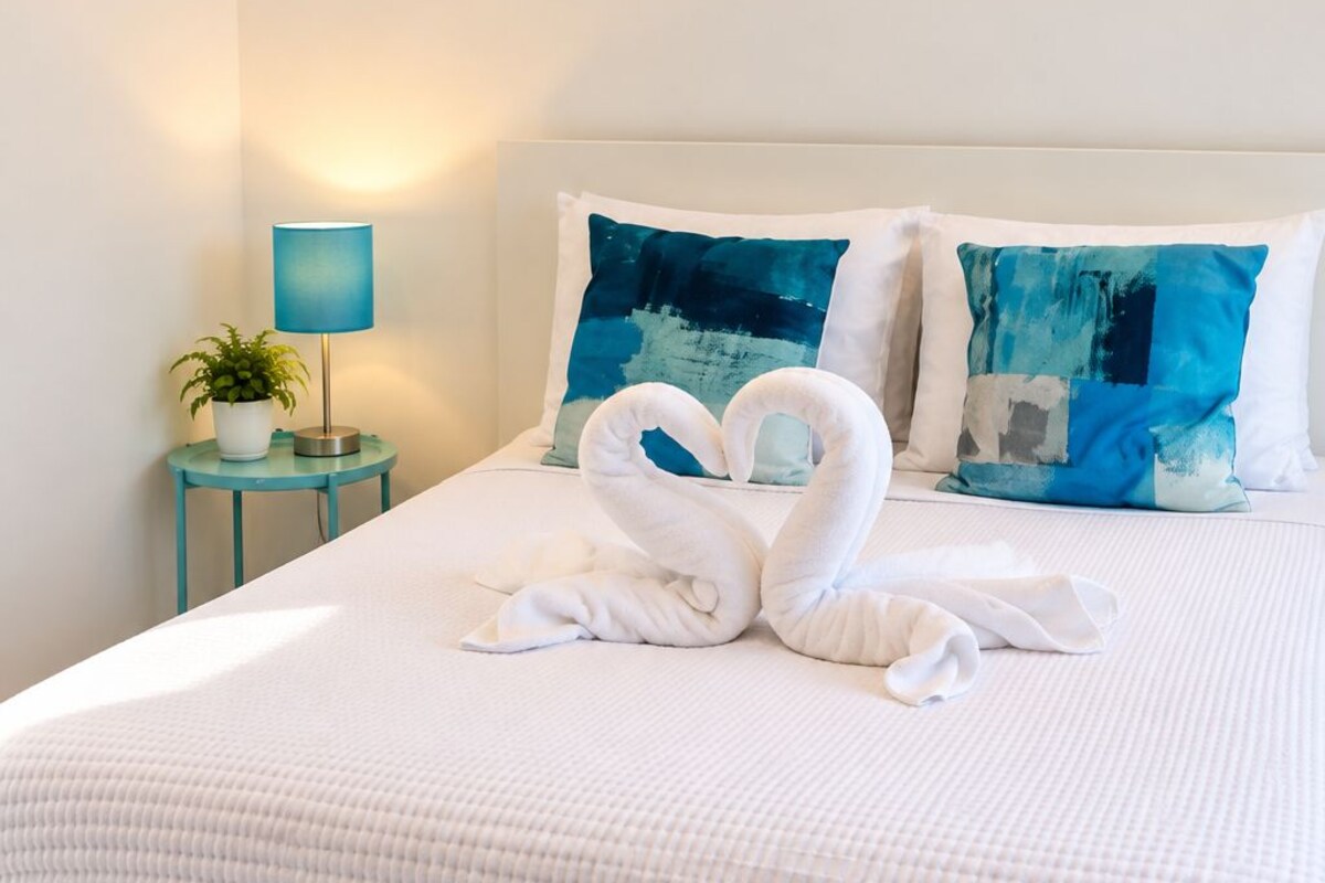 Premium bedding, down comforters, blackout drapes, iron/ironing board