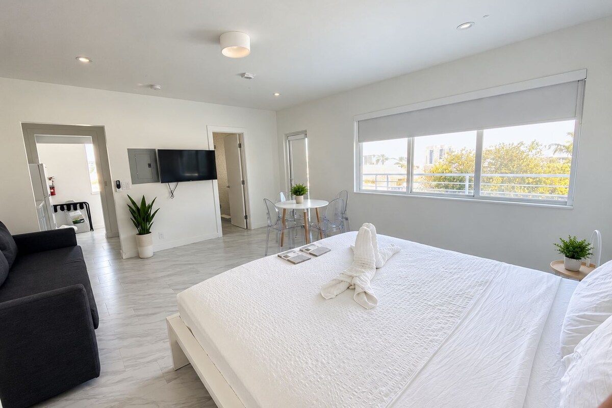 Deluxe Studio Suite | Premium bedding, down comforters, blackout drapes, iron/ironing board