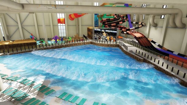 An indoor water park with a wave pool, slides, and lounge chairs. - Newly Renovated Home near Kalahari Resorts (Round Rock)