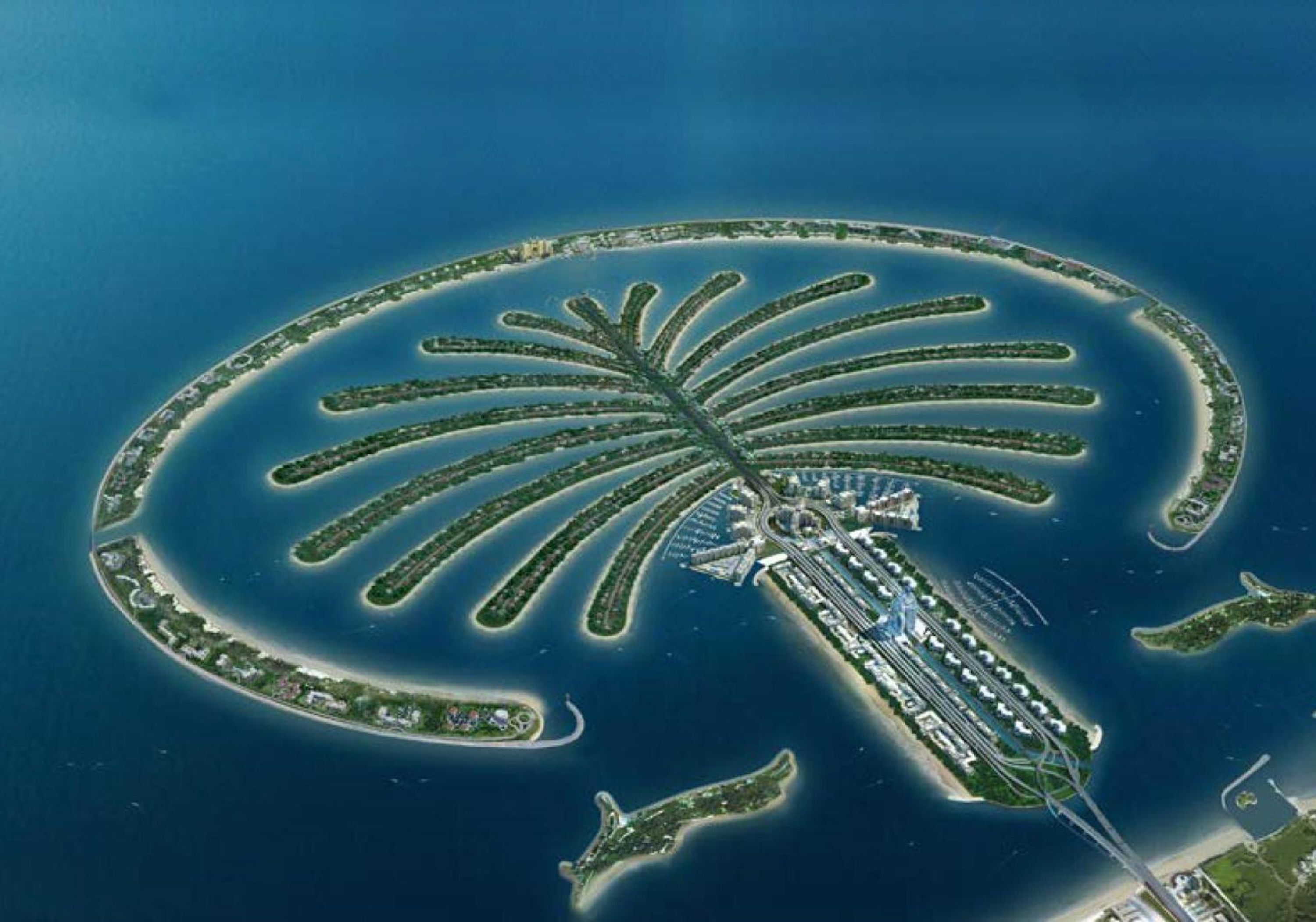 An aerial view of a palm-shaped resort island with multiple connected sections, a central marina, and a bridge linking to the mainland.