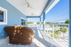 Relax on a wicker sofa with a view of the dock and surrounding waters.