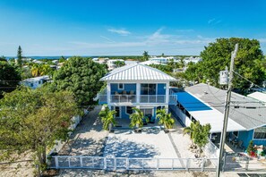 Relax in a serene coastal setting with a spacious patio and ocean views.