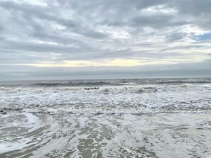 A beach with waves and a cloudy sky. - Peaceful St. Simons Stay Near Beaches & Golf (St. Simons Island)