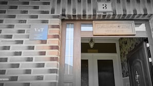 A brick building with a sign indicating 'VUT' and 'CASA-VISI' with a number '3' above the entrance. - RURAL ENVIRONMENT, land of fields and vineyards.GORDONCILLO (Gordoncillo)