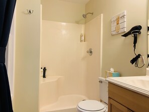 Bathtub, hair dryer, towels