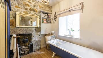 Bathtub, hair dryer, towels, soap