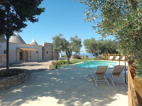 Panoramic trulli for 7 people in the hills with exclusive swimming pool 8 km from the sea