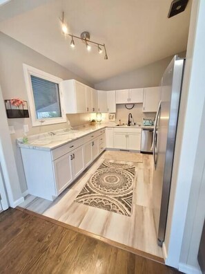 Fridge, coffee/tea maker, cookware/dishes/utensils