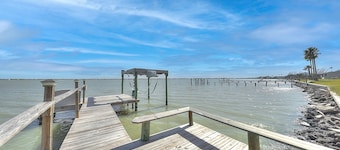 Bayfront home with private dock, deck, screened lanai, central ac, & WiFi