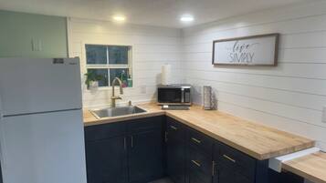 Fridge, microwave, coffee/tea maker, toaster