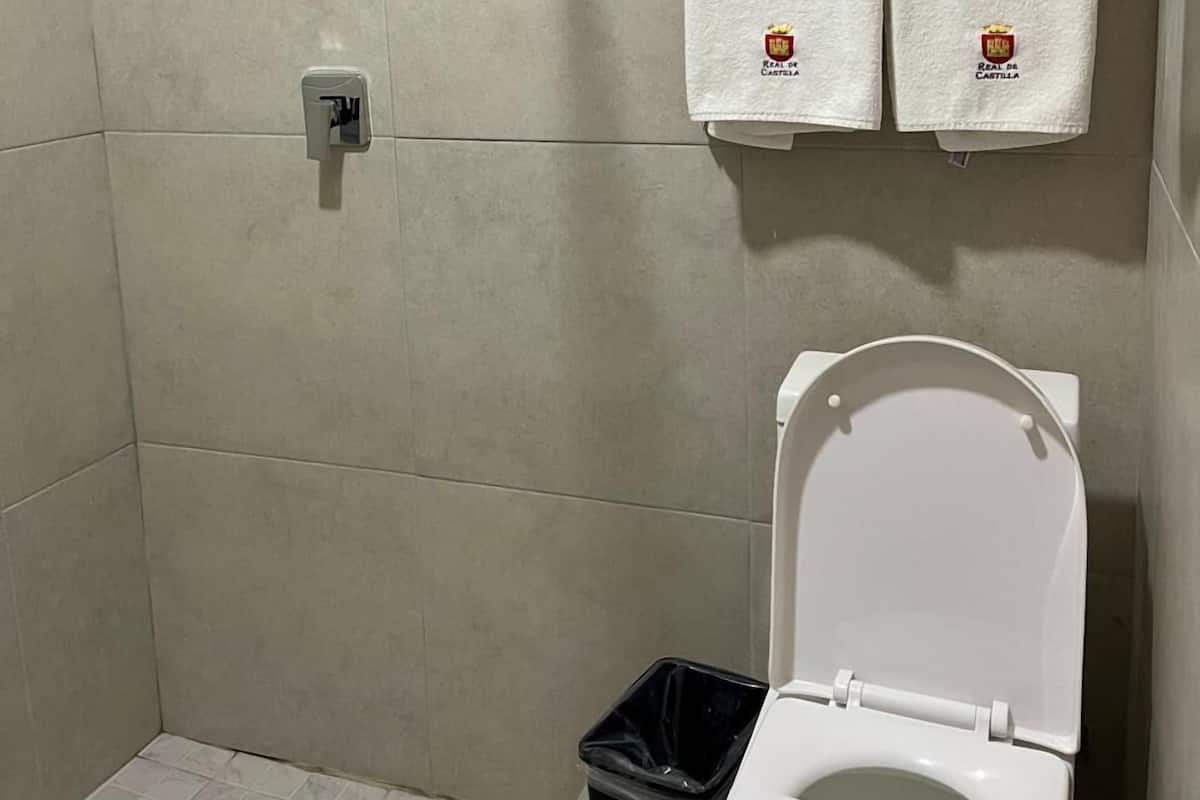 Room, 2 Queen Beds | Bathroom | Shower, rainfall showerhead, towels, soap