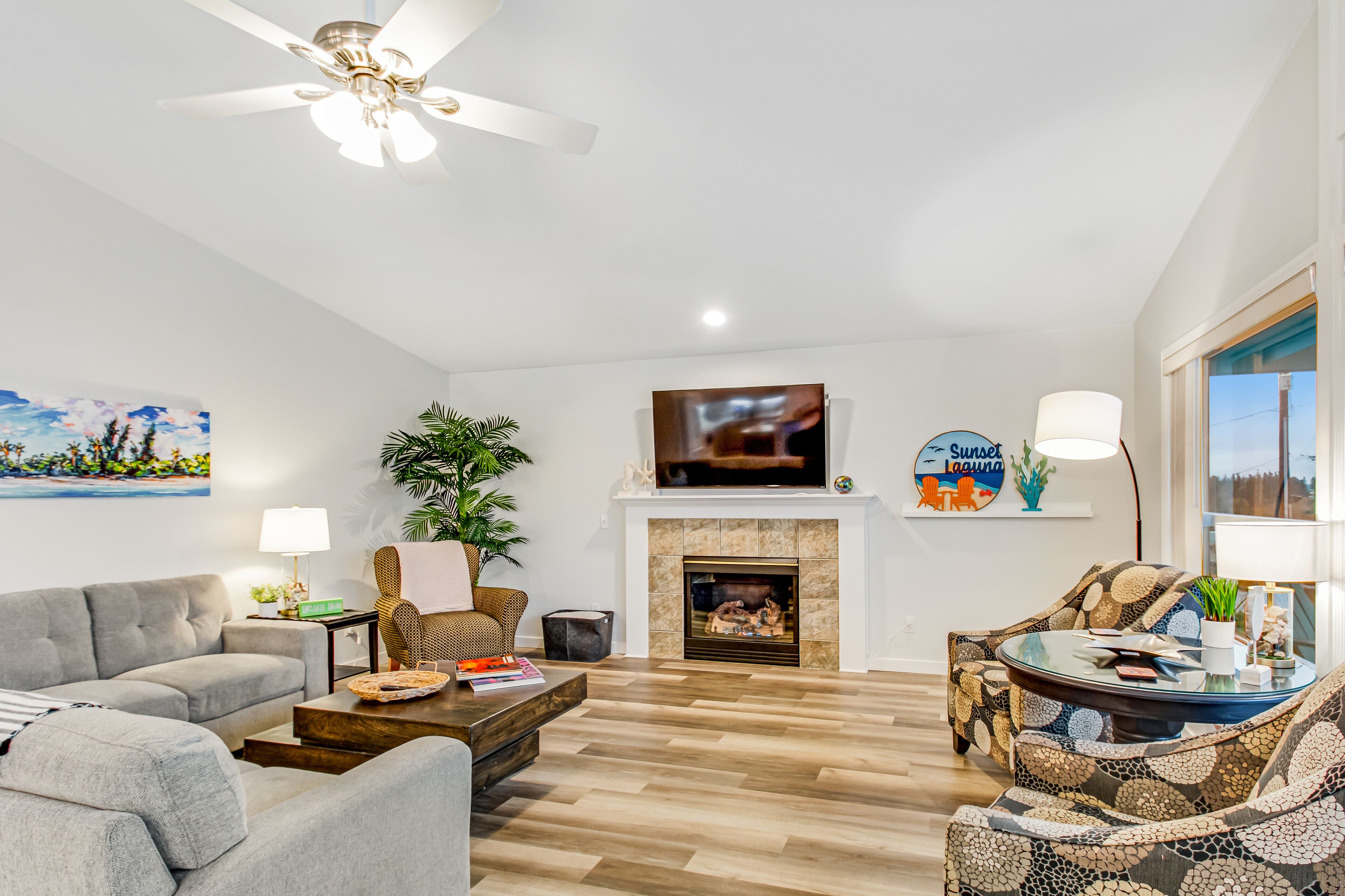 Water-view wonder with private hot tub, guest suite, game room, fireplace & W/D