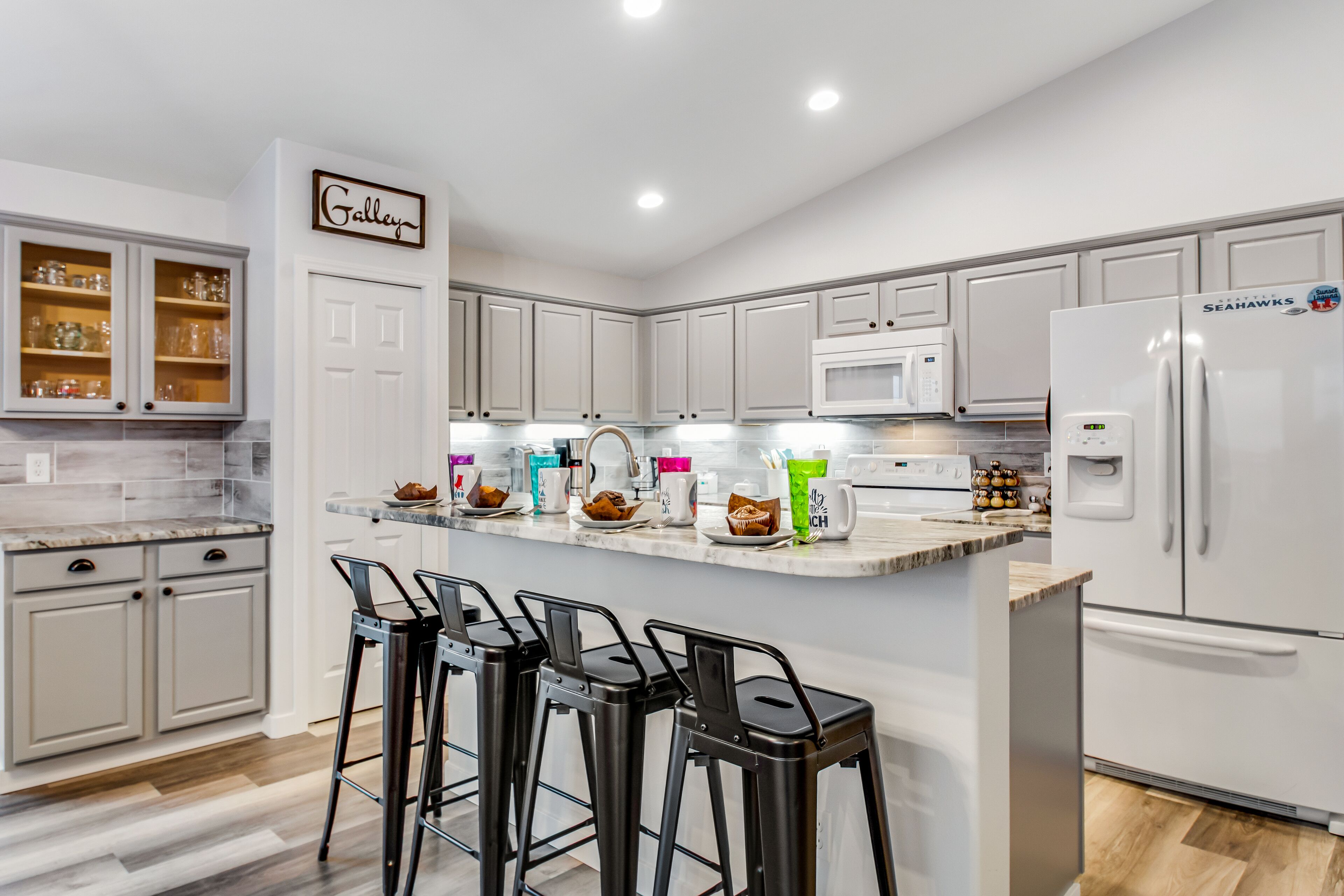 Water-view wonder with private hot tub, guest suite, game room, fireplace & W/D