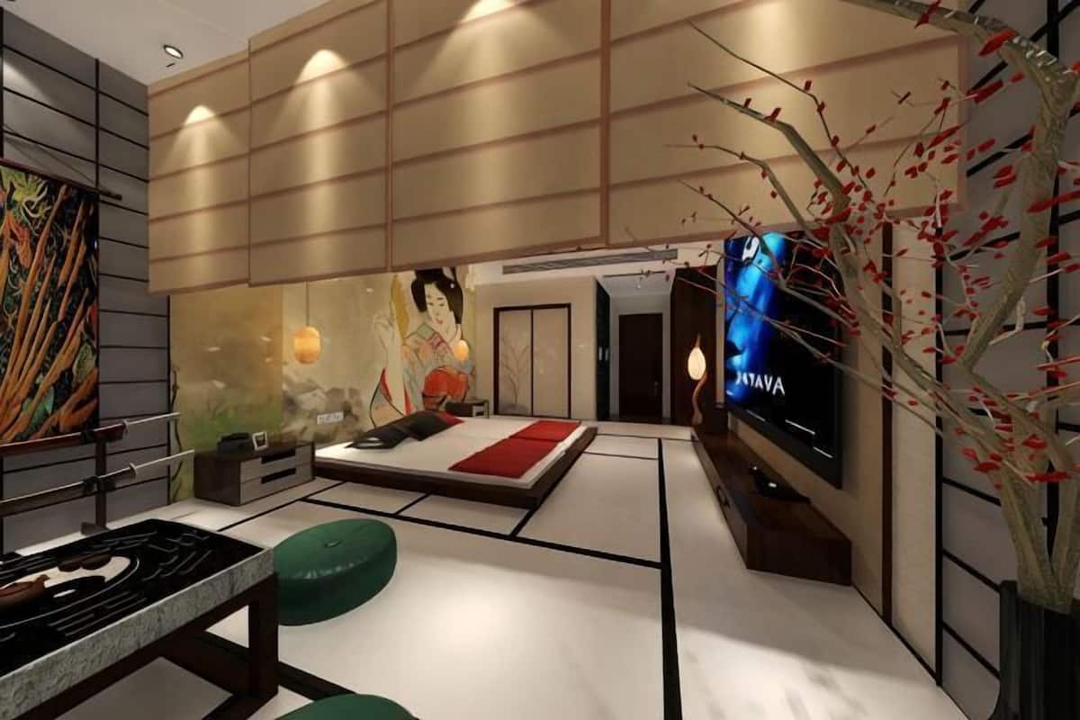 Una sala de estar moderna con televisor de pantalla plana, un sofá, una mesita de centro y una planta decorativa.