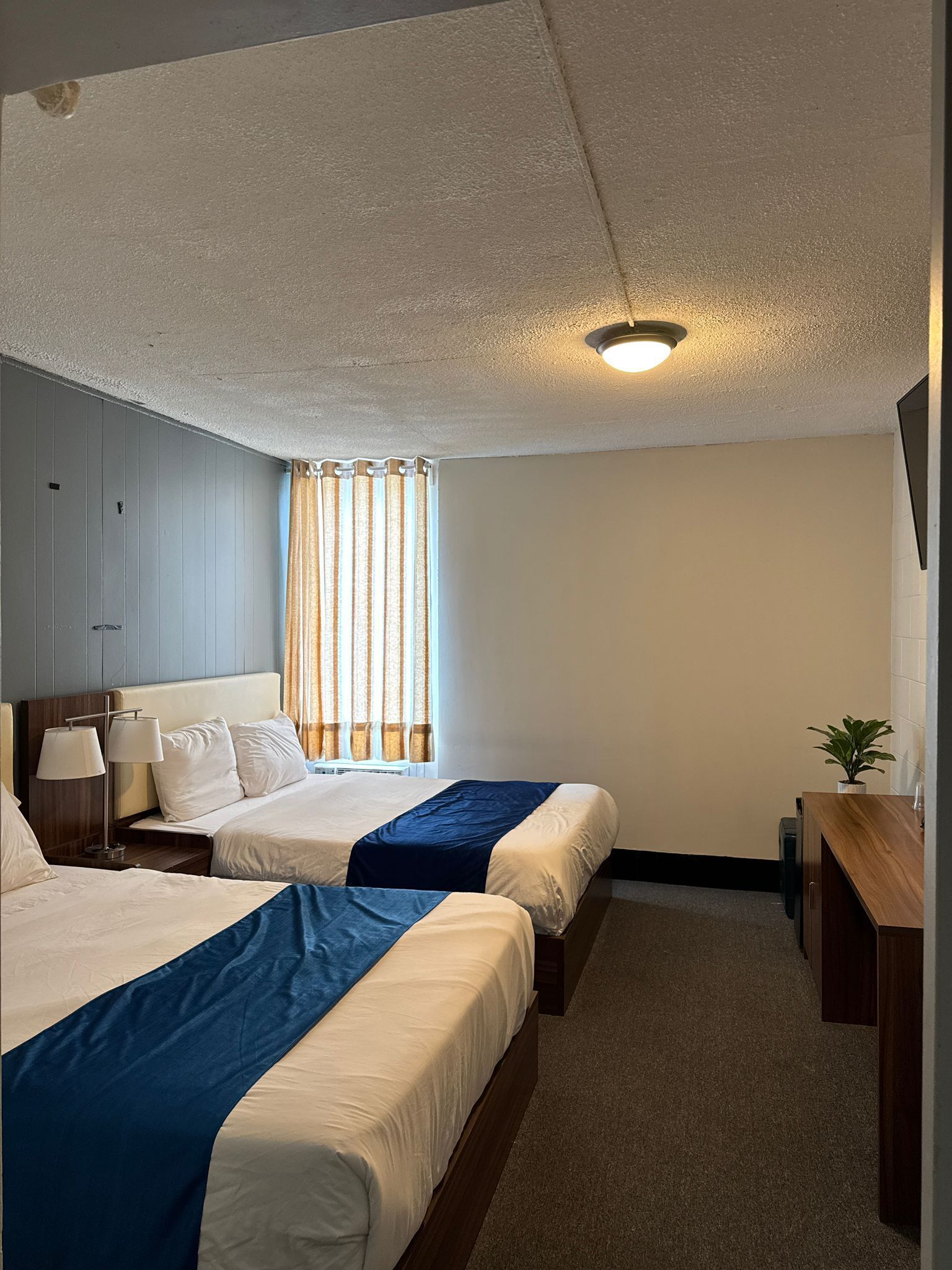 Select Comfort beds, desk, laptop workspace, blackout curtains