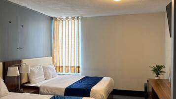Select Comfort beds, desk, laptop workspace, blackout curtains