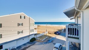 A residential building with a view of the beach and ocean. - Beachfront Old Orchard Beach Condo w/ Balcony (Old Orchard Beach)