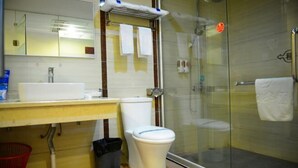 A bathroom with a toilet, sink, and glass shower enclosure. - Huifeng Hotel (Shaoguan)