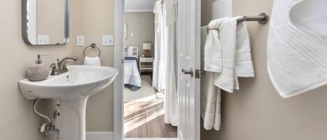 Combined shower/tub, hair dryer, towels, soap