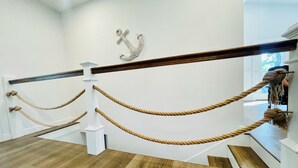 A wooden staircase with a rope barrier. - Lakefront Home w/ Dock on Old Hickory Lake (Gallatin)