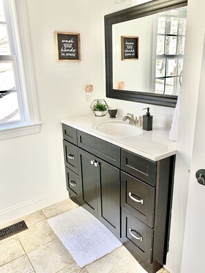 Combined shower/tub, hair dryer, towels, soap