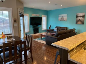 Smart TV, fireplace, books, stereo