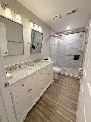 Bathtub, hair dryer, towels, soap