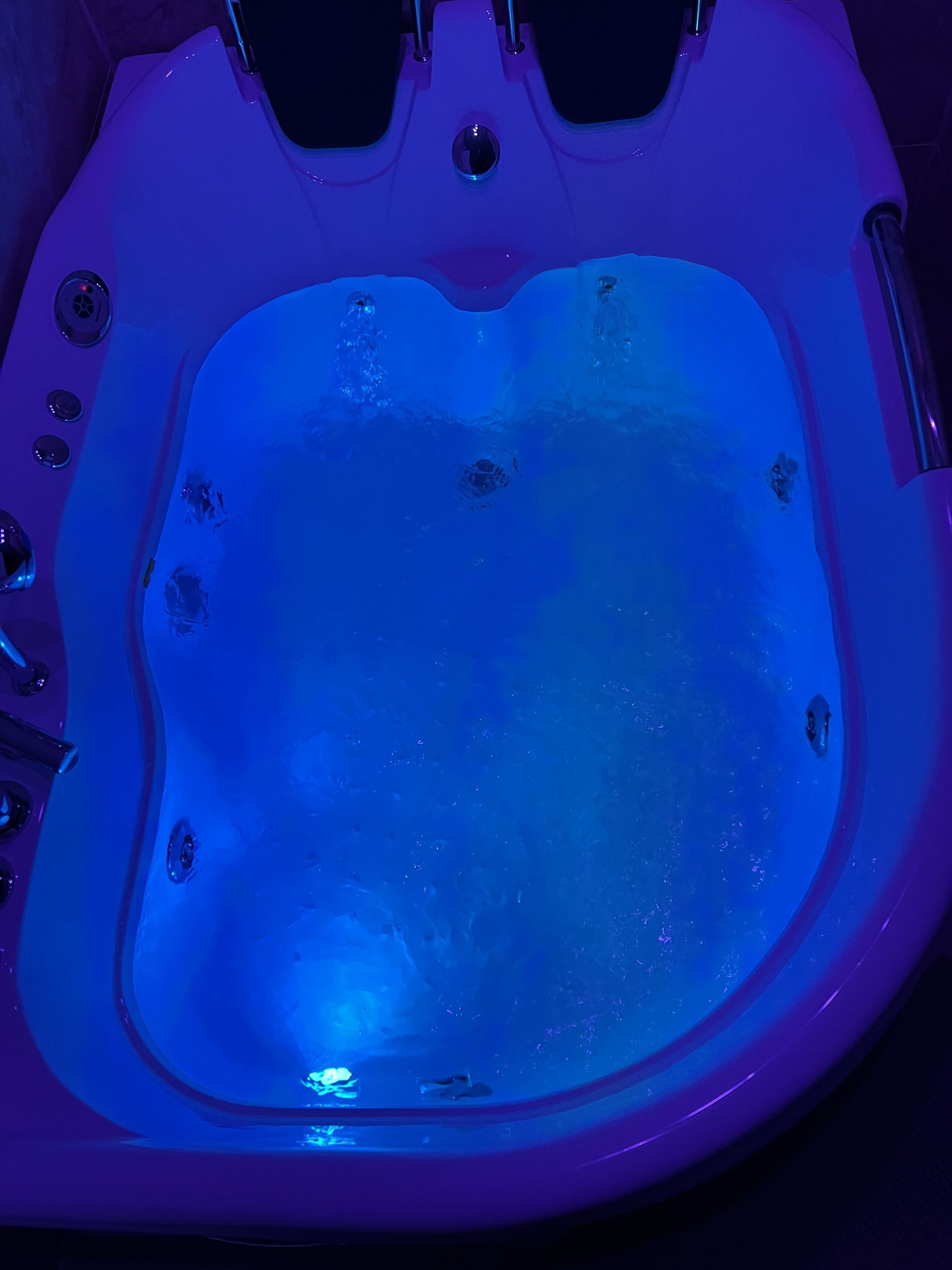 A hot tub with a blue light.