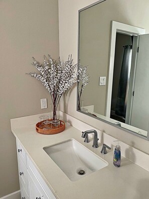 Combined shower/tub, hair dryer, towels, soap