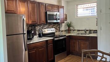Coffee/tea maker, fridge, microwave, oven