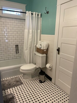Combined shower/tub, hair dryer, towels, soap