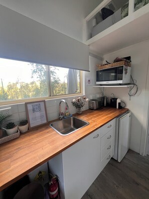 Fridge, microwave, stovetop, coffee/tea maker