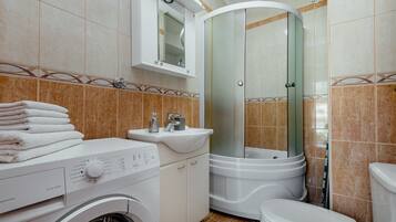Shower, towels, soap, toilet paper