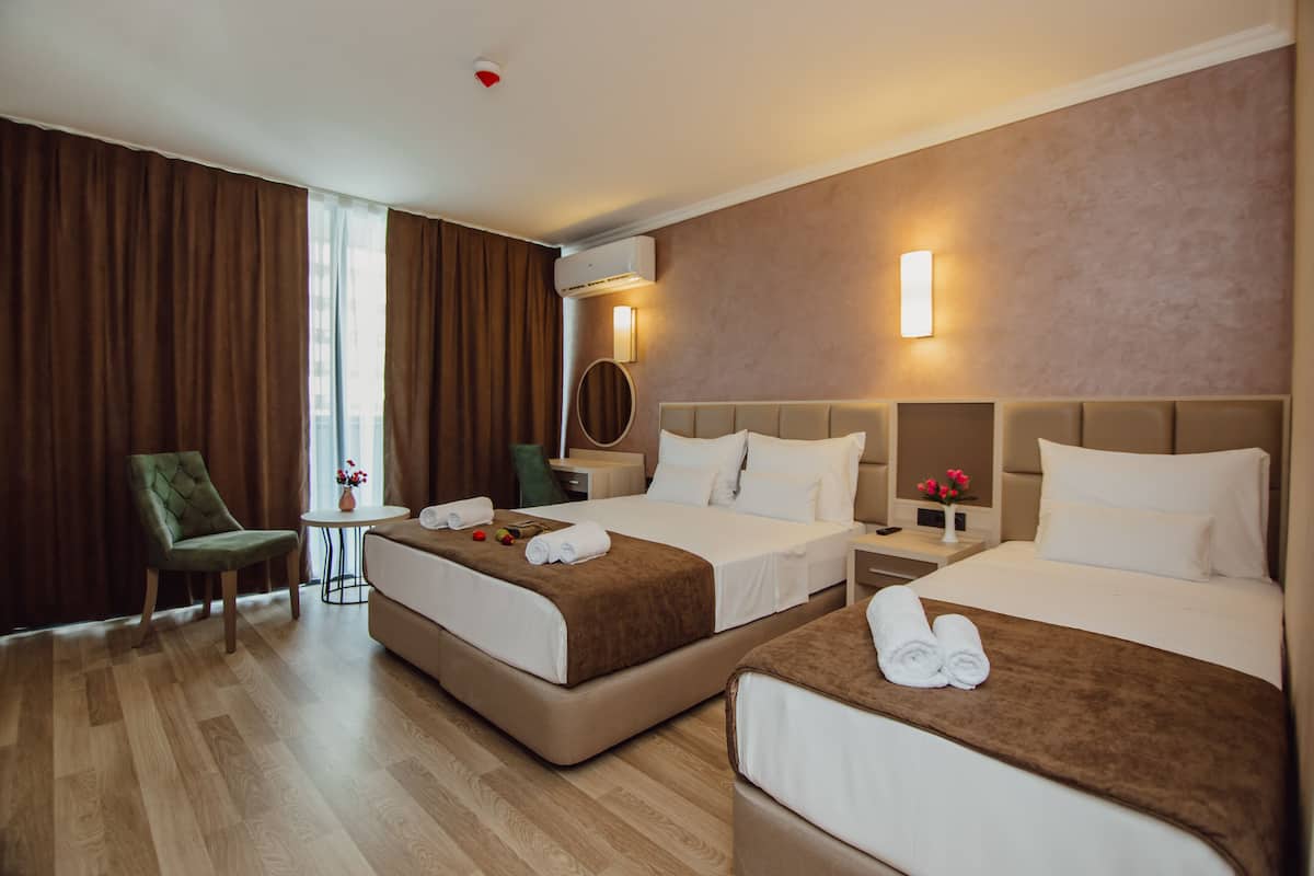 Family Triple Room | Hypo-allergenic bedding available, minibar, desk, laptop workspace