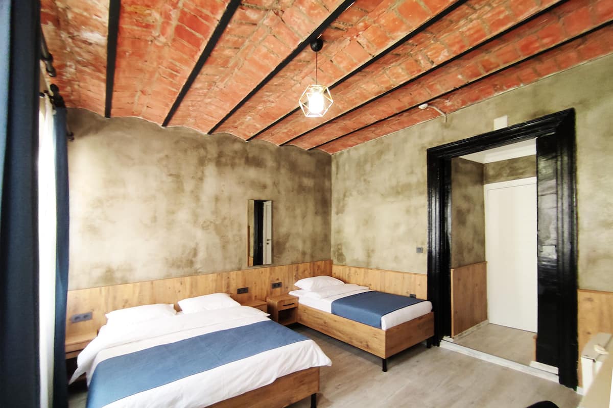 Desk, laptop workspace, free WiFi, bed sheets