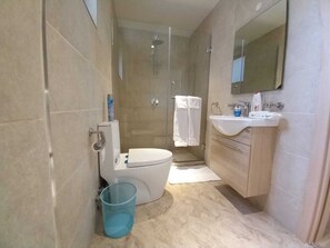 Business Apartment | Bathroom | Shower, free toiletries, slippers, towels - Stay.Plus Mandera Road Apartment (Nairobi)